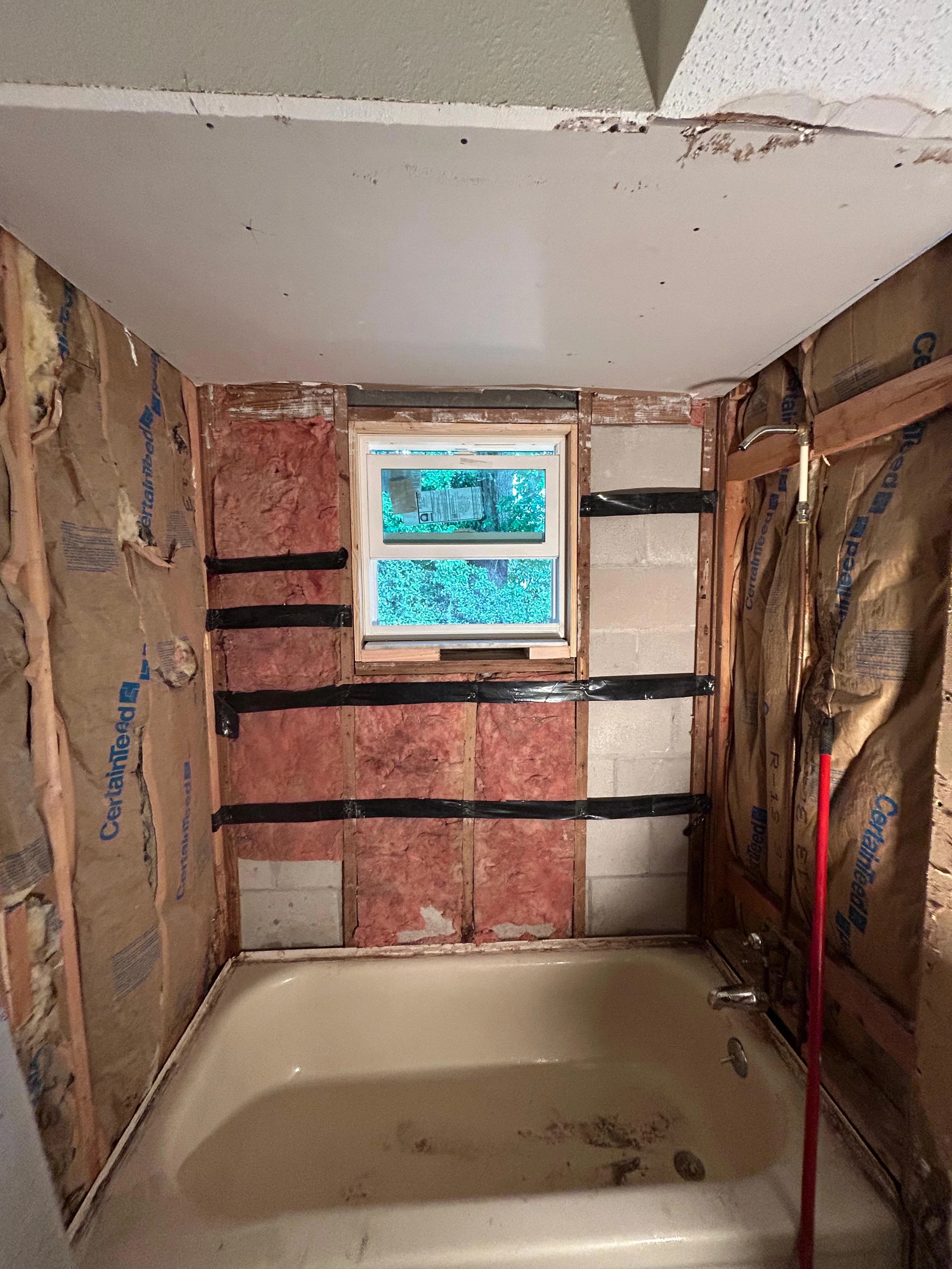 Master bathroom renovation with new insulation, rough-in plumbing and window — Orlando FL contractor